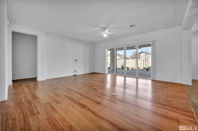 spare room with ceiling fan and light hardwood / wood-style floors