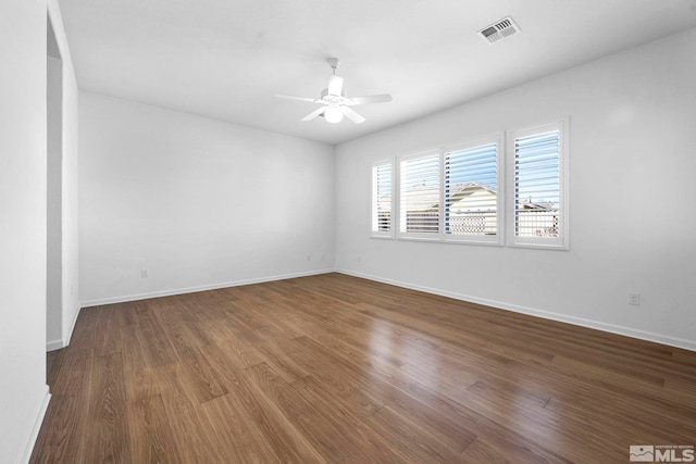 spare room featuring hardwood / wood-style flooring and ceiling fan