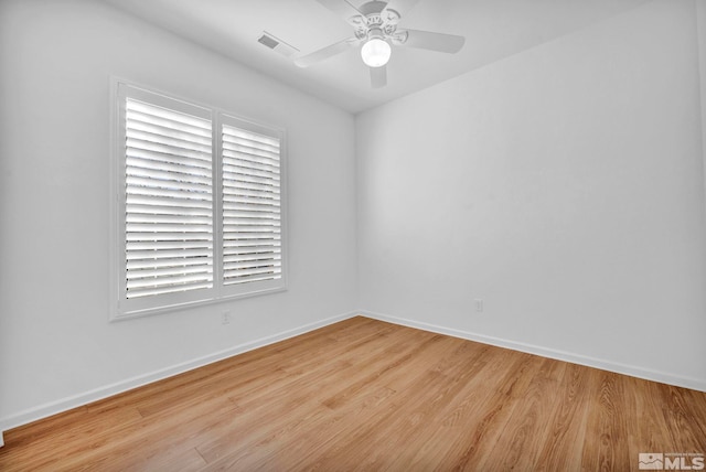 spare room featuring ceiling fan and light hardwood / wood-style floors