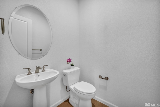 bathroom with sink and toilet