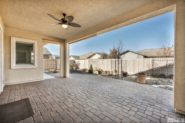 view of patio / terrace featuring ceiling fan