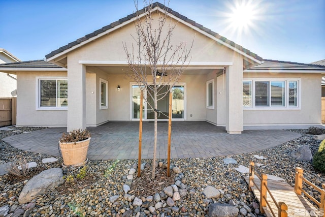 back of house featuring a patio