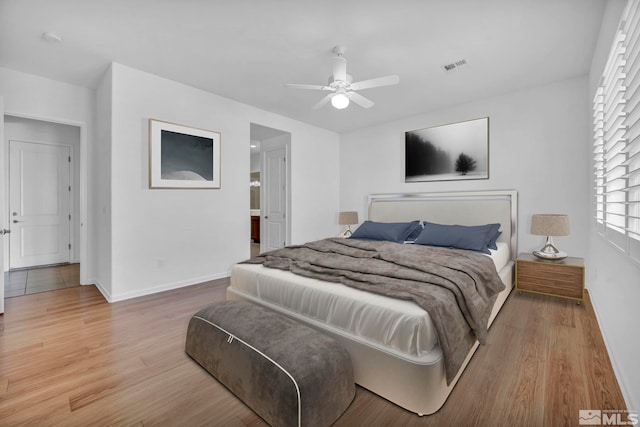 bedroom featuring hardwood / wood-style floors and ceiling fan