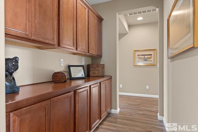 bar featuring light hardwood / wood-style flooring