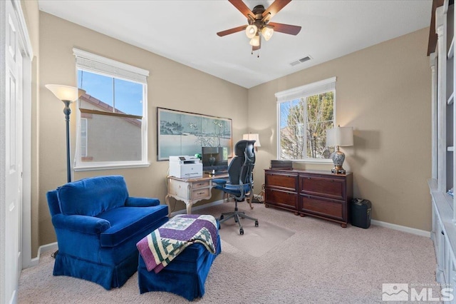 office area with ceiling fan and light colored carpet