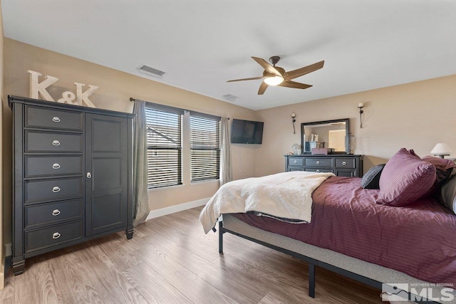 bedroom featuring light hardwood / wood-style flooring and ceiling fan