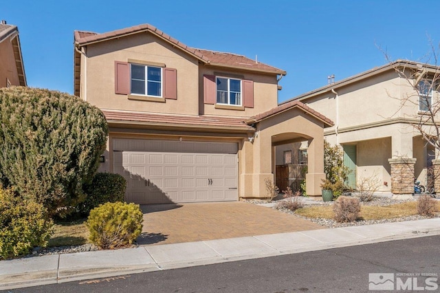 front of property featuring a garage