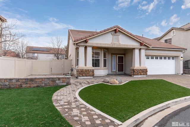 view of front of house with a garage and a front lawn