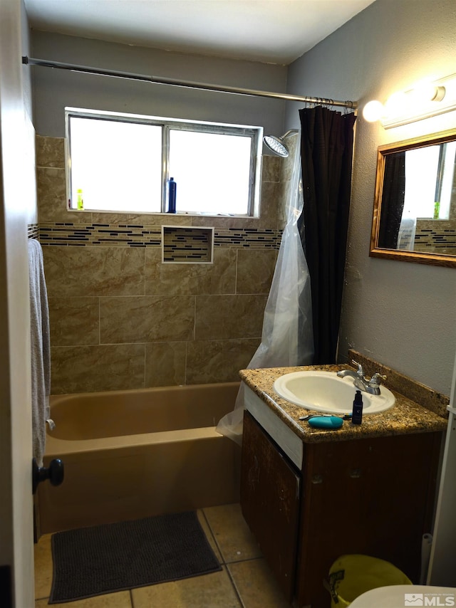 full bathroom featuring vanity, shower / bath combo with shower curtain, and a wealth of natural light