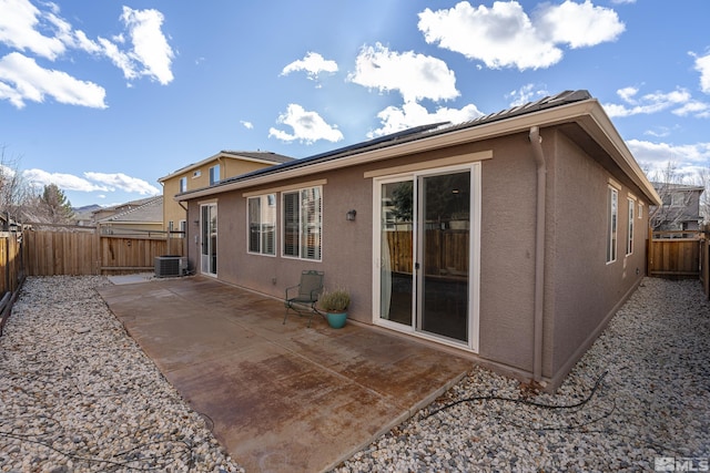 back of house featuring central AC and a patio area