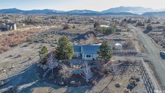 birds eye view of property with a mountain view