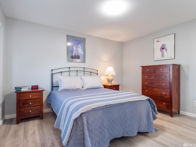 bedroom with light wood-type flooring