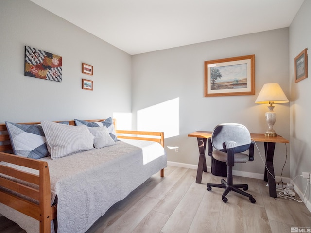 bedroom featuring wood-type flooring