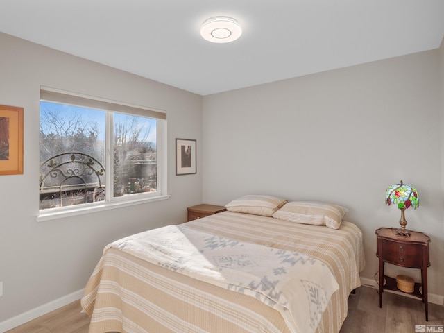 bedroom featuring hardwood / wood-style floors