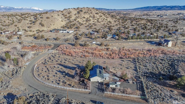 birds eye view of property featuring a mountain view