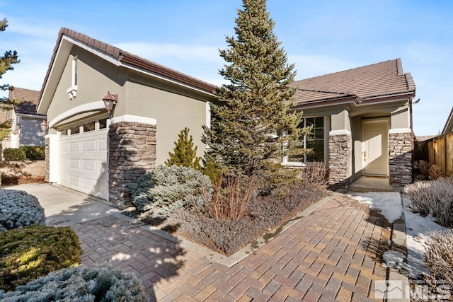 view of front of property featuring a garage