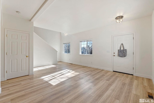 entrance foyer with light hardwood / wood-style floors