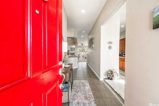 interior space featuring dark tile patterned flooring