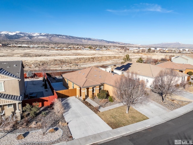 birds eye view of property with a mountain view