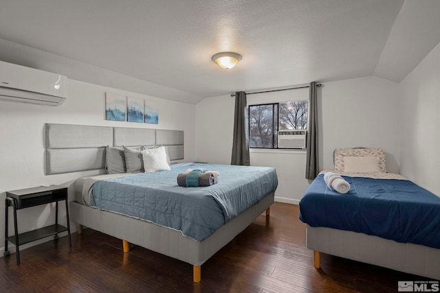 bedroom featuring a wall mounted air conditioner, dark hardwood / wood-style floors, vaulted ceiling, and a textured ceiling