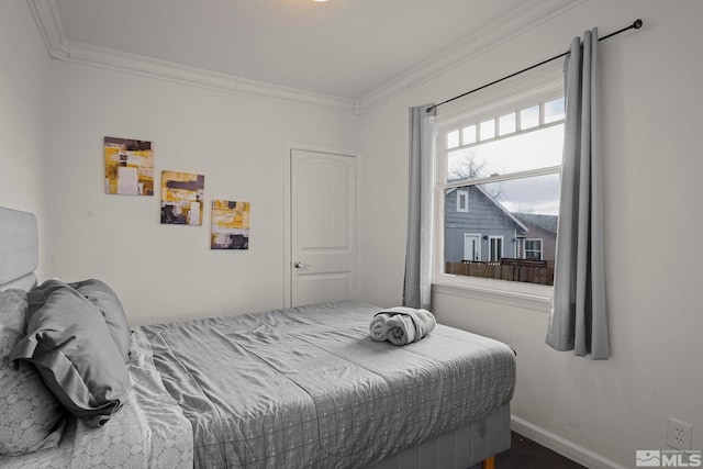 bedroom featuring crown molding