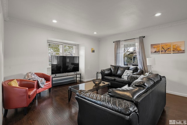 living room with ornamental molding, plenty of natural light, and dark hardwood / wood-style flooring