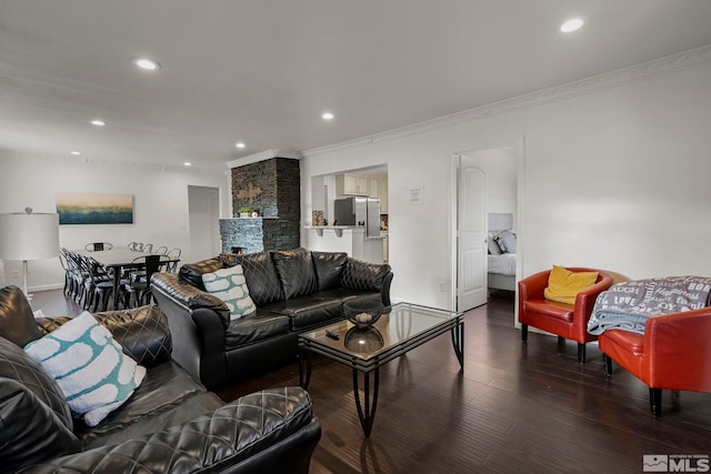 living room featuring crown molding and dark hardwood / wood-style flooring