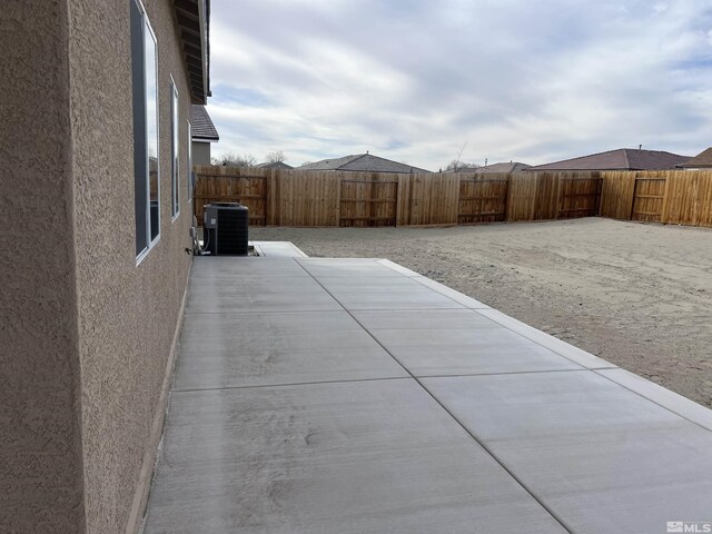 view of yard featuring a patio area and central air condition unit