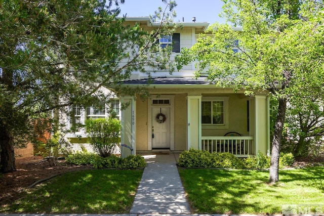 view of front of home with a front lawn