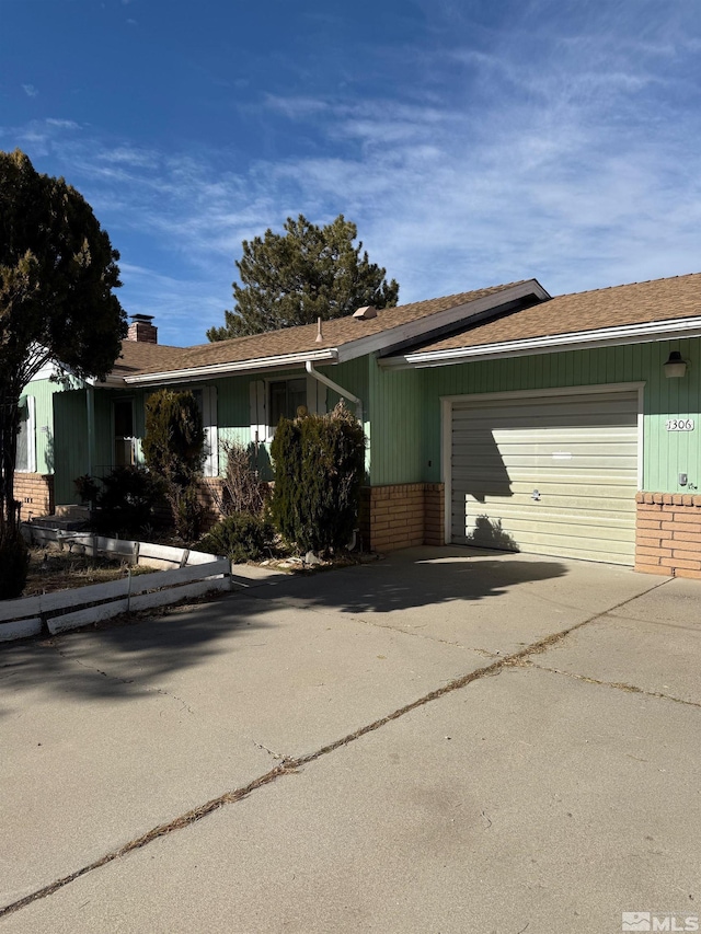 single story home featuring a garage