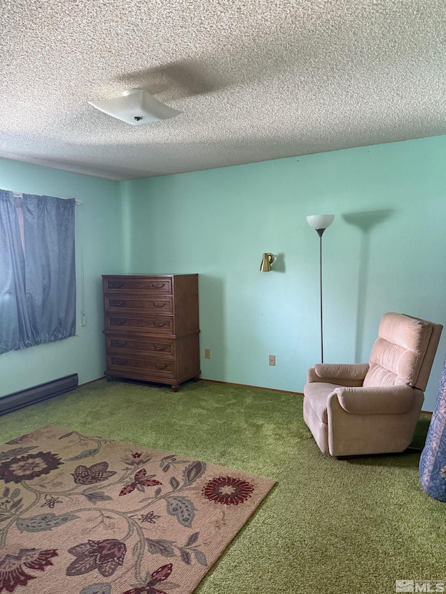 sitting room featuring carpet, a textured ceiling, and baseboard heating