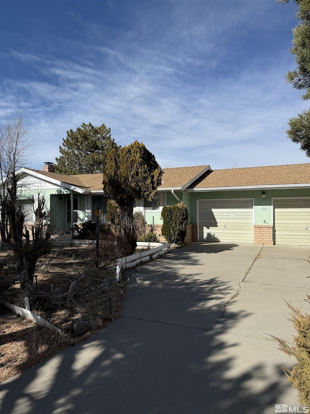 ranch-style house featuring a garage