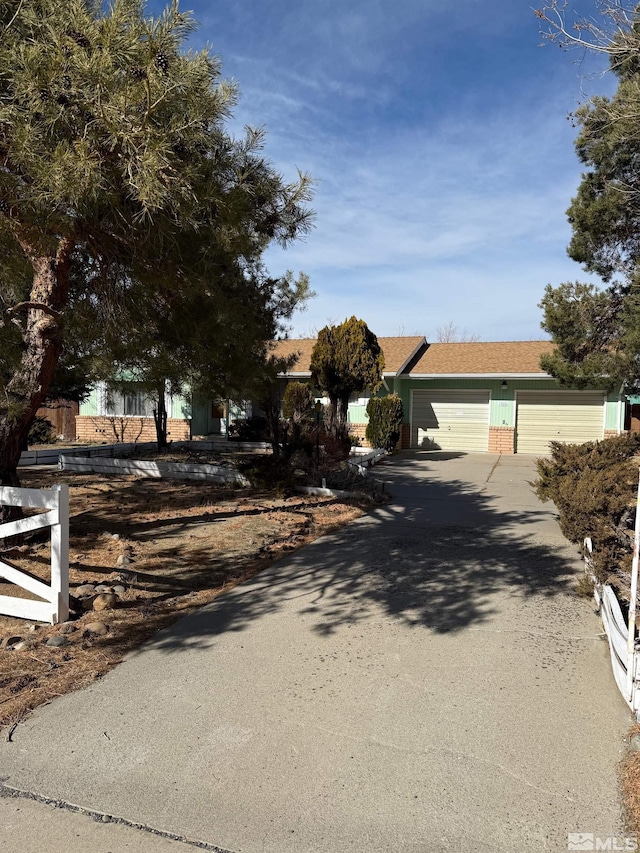 obstructed view of property featuring a garage