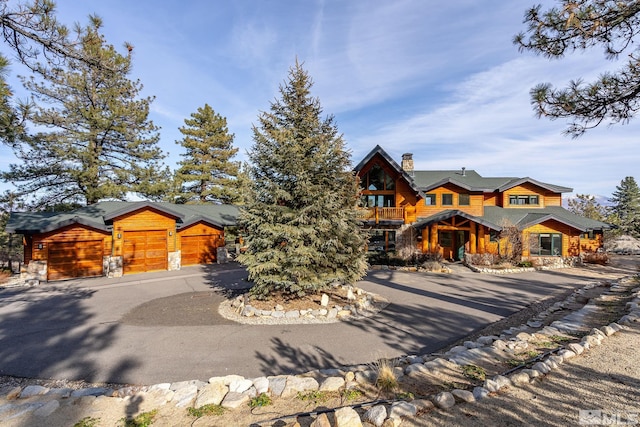 log cabin featuring a garage