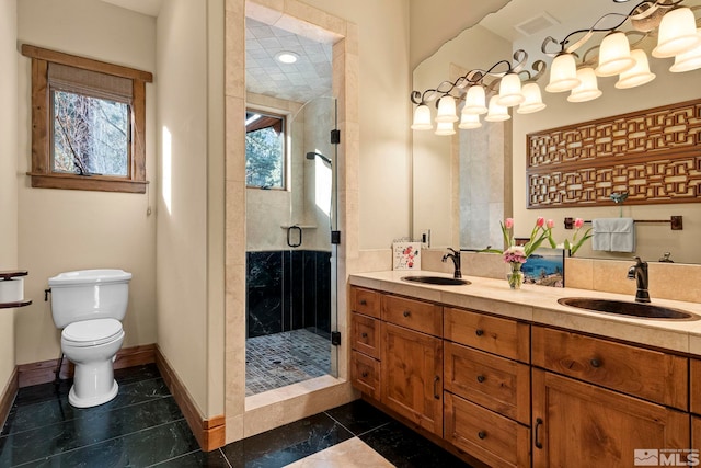 bathroom with an enclosed shower, vanity, tile patterned floors, and toilet