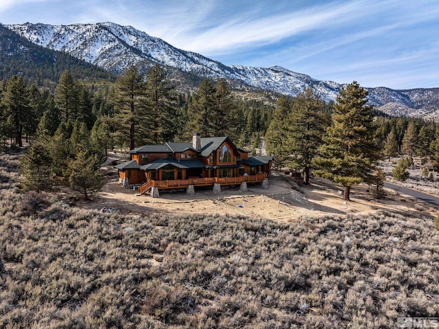 back of house featuring a deck with mountain view