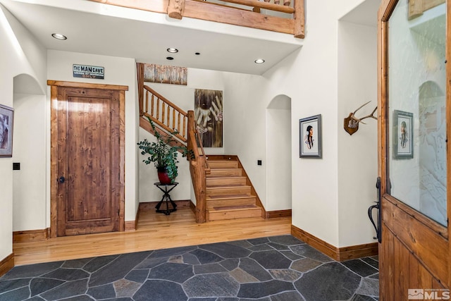 foyer entrance featuring dark hardwood / wood-style floors