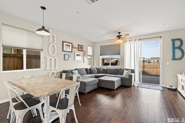 living room with dark hardwood / wood-style floors and ceiling fan