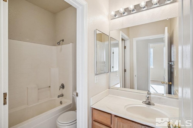 full bathroom with shower / washtub combination, toilet, and vanity