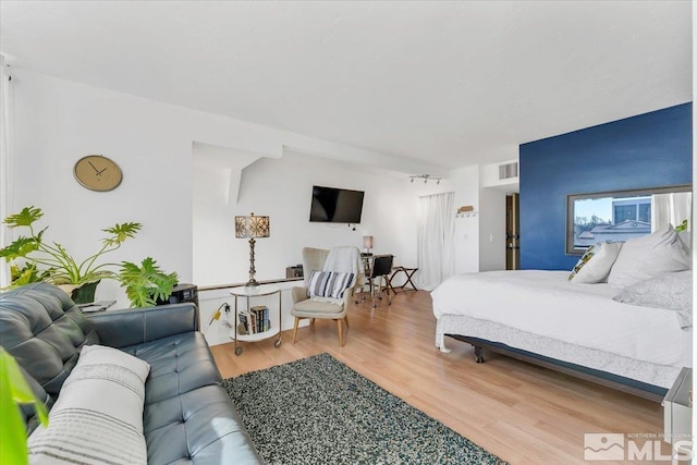 bedroom featuring wood-type flooring