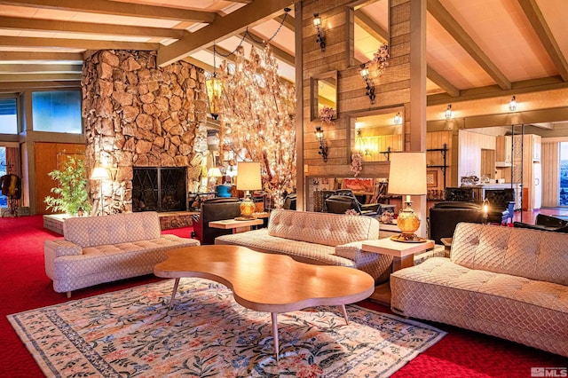 living room with beamed ceiling, a stone fireplace, and high vaulted ceiling
