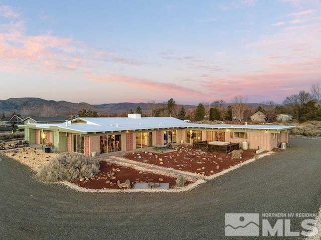 single story home featuring a mountain view