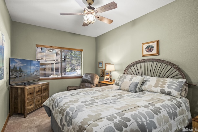 bedroom featuring light colored carpet and ceiling fan