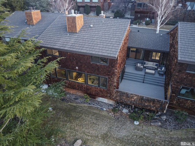 rear view of house featuring an outdoor living space