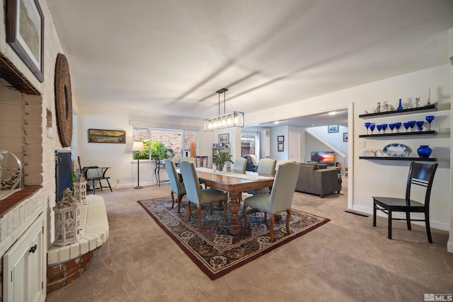 view of carpeted dining area