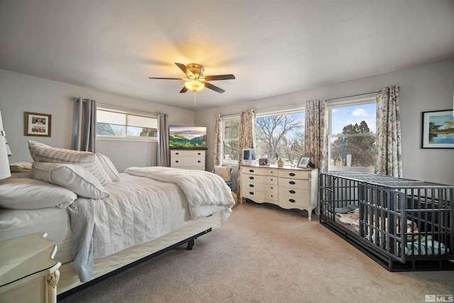 carpeted bedroom featuring ceiling fan