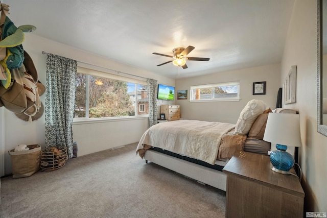 carpeted bedroom with ceiling fan