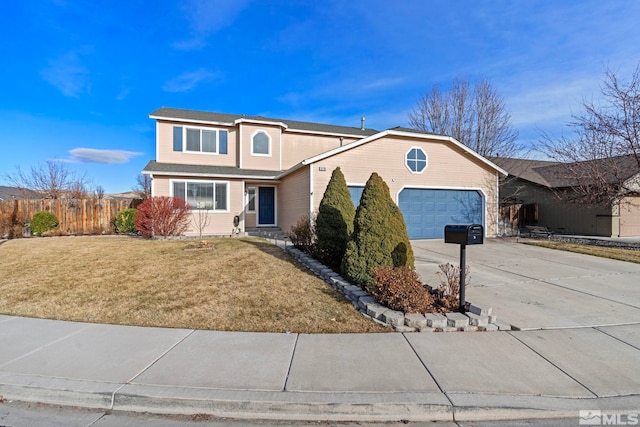 view of front of property featuring a garage and a front lawn