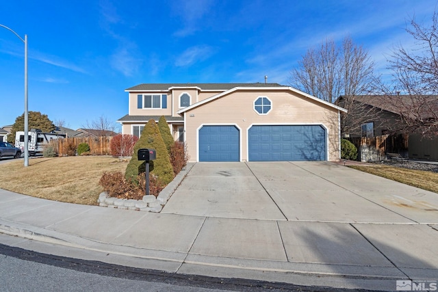 front of property featuring a garage and a front yard