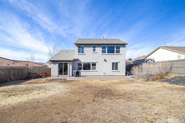 back of property featuring a patio